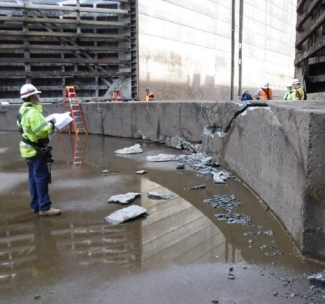 Engineers inspect damage to the sill block in the Bonneville navigation lock chamber. The damage to the navigation lock sill stopped water-borne commerce on the Columbia River for three weeks as crews worked to repair the damage.