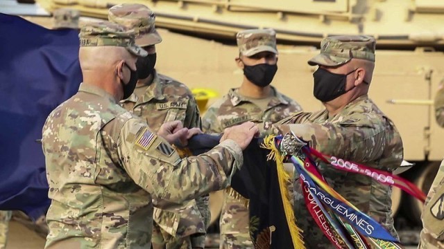 Lt. Col. Rodney Seaba, left, commander of the Kansas Army National Guard’s 2nd Combined Arms Battalion, 137th Infantry Regiment, and Command Sgt. Maj. Paul Purdham, right, case the regimental colors of the Kansas Army National Guard’s 2nd CAB, 137th Inf. Regt. during a virtual ceremony Oct. 17. The ceremony was held to redesignate the 2nd CAB, 137th Inf. Regt. “First Kansas” as the 1st Battalion, 635th Armor Regiment in accordance with a 2012 Army Chief of Staff directive.