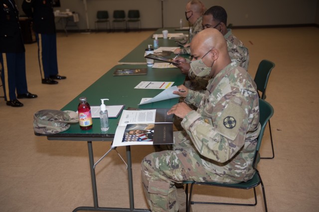 Master Sgt. Marshall Dykes, the 13th Expeditionary Sustainment Command, reviews a board packet Oct. 16.  Career counselors from the 13th Expeditionary Sustainment Command and 1st Medical Brigade participated in the Career Counselor of the Year competition Oct. 15-16.