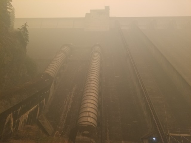 Mike Pomeroy, trapped at Detroit Dam by wildfires, took photos of the dam, which was surrounded by wildfire smoke.