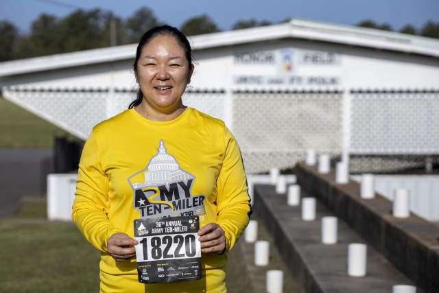U.S. Army Staff Sgt. Chang Yang, a motor transport operator assigned to Headquarters and Headquarters Company, 3rd Brigade Combat Team, 10th Mountain Division, holds up her race bib for the 36th Annual Army Ten-Miler, Virtual Edition, October 18, 2020, at Honor Field, Fort Polk, Louisiana. Yang began the race at 7 a.m., October 17, 2020, and finished within one hour, 47 minutes, 52 seconds.