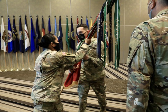 KADENA AIR FORCE BASE, Japan – Lt. Col. Rosanna Clemente, 1st Battalion, 1st Air Defense Artillery Regiment commander, passes the battalion colors to Command Sgt. Maj. Daniel S. Venton, signifying the transfer of responsibility during an...