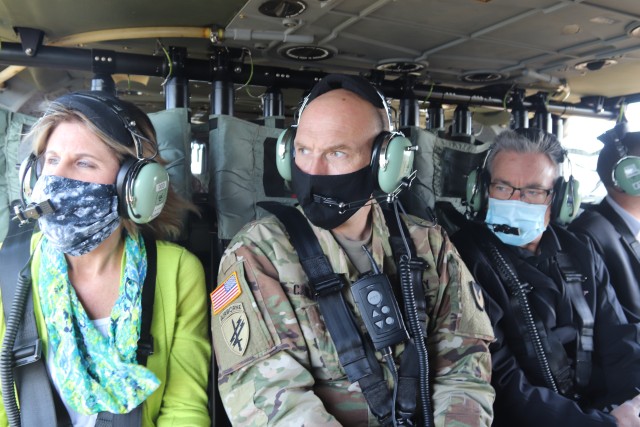 Local civic leaders are shown Oct. 6, 2020, participating in a helicopter overflight of the installation during a special visit by community leaders to Fort McCoy, Wis. More than a dozen civic leaders from Tomah and Sparta, Wis., participated in the community leader engagement. The event included involvement from the Fort McCoy Garrison command team, including Garrison Commander Col. Michael D. Poss; Garrison Deputy Commander Lt. Col. Alexander L. Carter; Command Sgt. Maj. Paul Mantha, garrison command sergeant major; Deputy to the Garrison Commander Brad Stewart; Directorate of Public Works Director Liane Haun; Directorate Plans, Training, Mobilization and Security Director Mike Todd; Directorate of Emergency Services Director Mark Fritsche; and many more. The 13 civic leaders included acting Tomah Veterans Administration Medical Center Director Karen Long; Tomah Mayor Mike Murray; Tomah Chamber of Commerce President and Chief Executive Officer Tina Thompson; Tomah business leaders Philip Stuart, Jeffery Cram, and Christian Dawley; Tomah Police Chief Mark Nicholson; Tomah School Superintendent Dr. Mike Hanson; Sparta Chamber of Commerce Executive Director Heidi Prestwood; Sparta Chamber business leaders Suzanne Hoffman, Shannon Davis, and Vincent Norris, and Sparta School Superintendent Amy Van Deuren. The visitors received a driving tour around the installation, the helicopter ride, and a visit to the Mission Training Complex for simulation training in the 200 block at Fort McCoy. (U.S. Army Photo by Scott T. Sturkol, Public Affairs Office, Fort McCoy, Wis.)