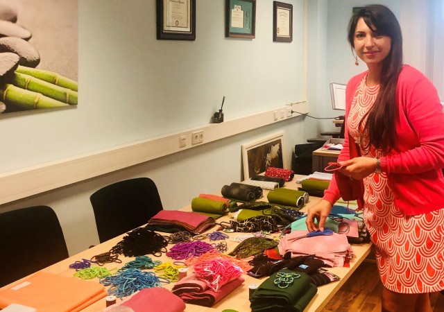 Janna Henderson, U.S. Army Garrison Rheinland-Pfalz Directorate of Family and Morale, Welfare and Recreation Non-Appropriated Funds Support Division chief, counts some of the nearly 4,000 masks DFMWR volunteers made for employees, Soldiers and...