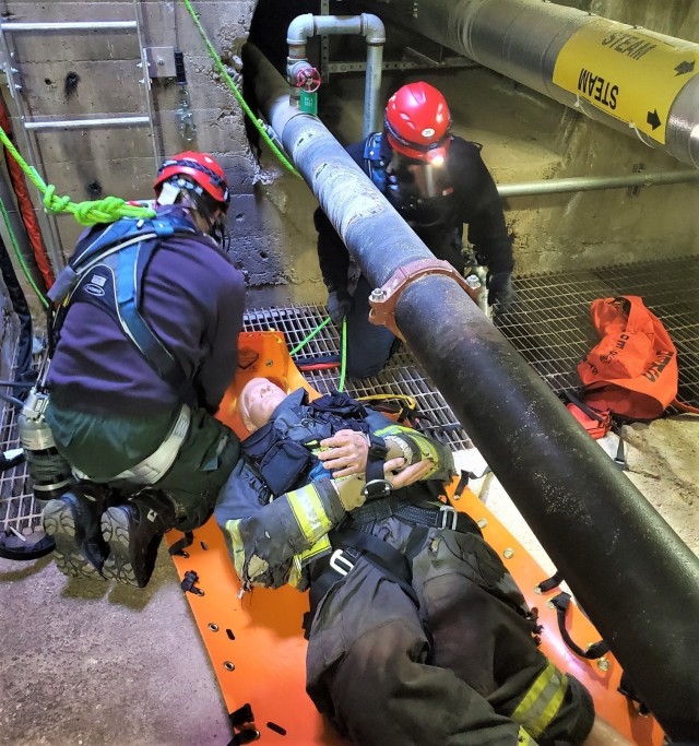 U.S. Army Garrison Alaska, Fort Greely Firefighters Colin Winkelman, left, and Mark Zastavskiy respond to a confined space rescue response scenario during a three week, agency mandated, training course provided by the Maryland Fire and Rescue Institute at the University of Maryland. (Courtesy Photo by U.S. Army Garrison Alaska, Fort Greely Fire Department)