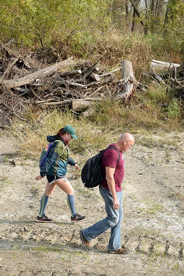 Military Wild co-founder Kailey Brown and Natural Resources Specialist Neil Bass begin a 2.5-mile hike for Military Wild members Oct. 17 near Sherman Army Airfield. Bass shared information about the area's plants and animals with hike participants...
