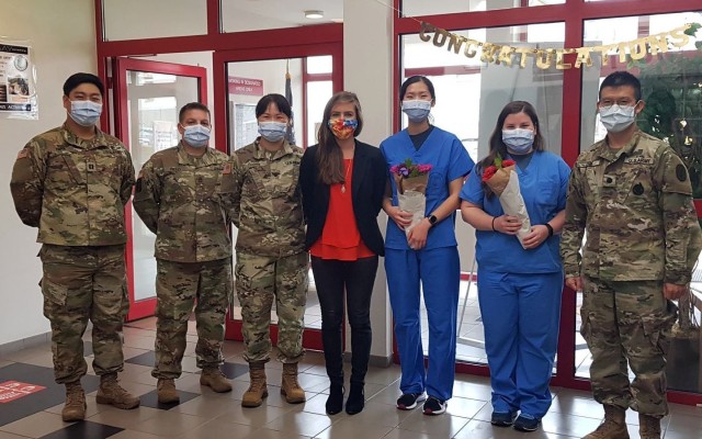 Staff at the Baumholder Dental Clinic, along with American Red Cross Regional Program Specialist Riley Swanson, congratulate this year’s graduates of the Dental Assistant Training Program, Mrs. Hyojeong Fisher and Mrs. Samantha Valentine.