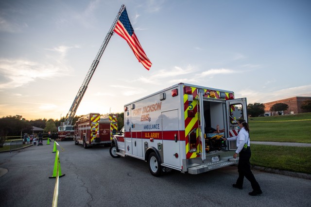 Sue Potashnik, Assistant Chief, Fort Jackson EMS, demonstrates the ease of using the power lift during National Night Out, Oct. 6.