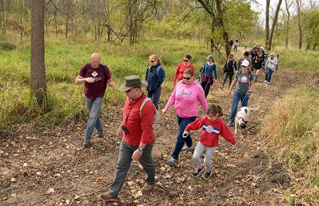 Natural Resources Specialist Neil Bass leads a group of Military Wild members on a 2.5-mile hike along the floodplain trail Oct. 17 near Sherman Army Airfield. Photo by Prudence Siebert/Fort Leavenworth Lamp