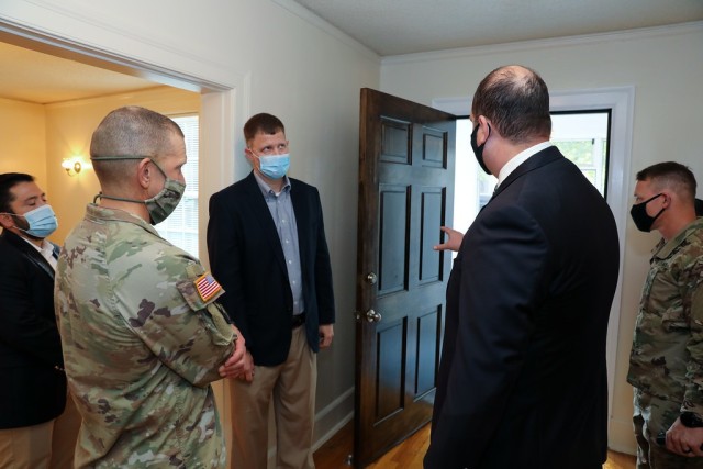 Sgt. Maj. of the Army Michael A. Grinston (left) gets a look at a recently renovated home here Oct. 22. With him are representatives of a private company that partners with Fort Benning to maintain more than 4,000 homes for military Families....