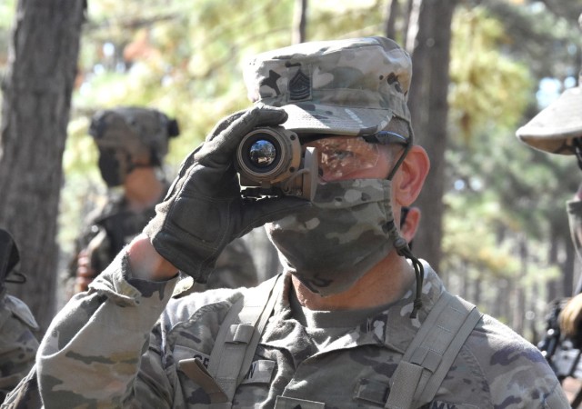 Sgt. Maj. of the Army Michael A. Grinston looks through a night vision goggle during his visit to the Joint Readiness Training Center and Fort Polk Oct. 21.