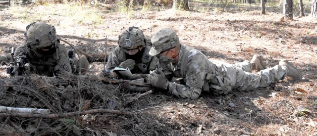 Sgt. Maj. of the Army Michael A. Grinston (far right) discusses field of fire markings with a C Co, 1st Bn, 21st Inf Reg, 25th Inf Div Soldiers during his visit to JRTC Rotation 21-01 Oct. 21.