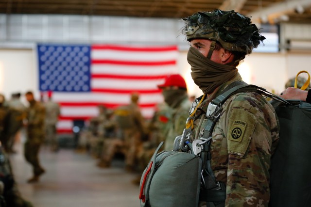 A paratrooper assigned to 1st Brigade Combat Team, 82nd Airborne Division, prepares for an airborne training operation at Fort Bragg, N.C., on May 7, 2020. The operation marked the division&#39;s return to limited training operations while following health and safety guidelines to prevent the spread of the novel coronavirus.  