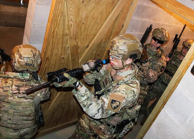 Cadets execute their close quarters strategy in the target building at the Aachen training area Oct. 11. Virtual reality rehearsal allowed the cadets to effectively modify their strategy when casing the building. It also allowed them to have a better intuitive understanding of the layout and increased spatial awareness of the building.