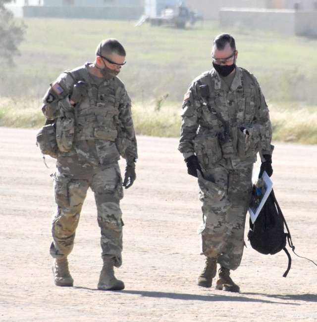 Sgt. Maj. of the Army Michael A. Grinston (left) and Joint Readiness Training Center and Fort Polk Command Sgt. Maj. Michael C. Henry walk toward waiting vehicles after exiting from UH-60 Blackhawk helicopters following their arrival at Hammerhead...