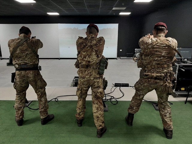 VICENZA, Italy - An Italian paratrooper with the with 183rd Regiment “Nembo”, from the “Folgore” airborne Brigade based off in Pistoia practice marksmanship skills while attending a training course for the Engagement Skills Trainer at...