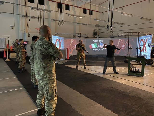 VICENZA, Italy - Italian army service members of the Multinational Civil-Military Cooperation Group headquartered at the town of Motta di Livenza, hone their shooting skills Gun Fighter Gym on Caserma Del Din Oct. 1, 2020. Joe Lynch (right), site...