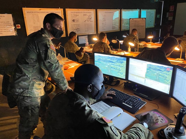 VICENZA, Italy - Staff Sgt. Nicholas R. Sohn (left) and Staff Sgt. Austin T. Nash, targeting non-commissioned officer instructors with the 173rd Airborne Brigade Combat Team (Infantry), facilitate a “Call for Fire” training session on Caserma...
