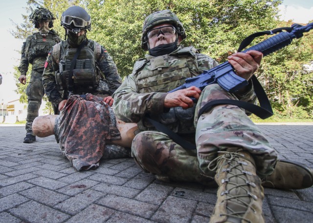 U.S. Army Lt. Col. Mark Lund, provides security during the Tactical Field Care (TFC) portion of the International Trauma Combat Casualty Care course at Landstuhl Regional Medical Center, Oct. 2. The international course, which included Service...