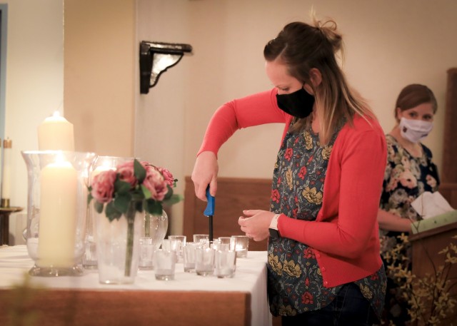 A guest lights a candle during the Pregnancy and Infant Loss Remembrance observance at LRMC, Oct. 15. The observance is held annually on Oct. 15 to remember pregnancy loss and infant death which includes but not limited to miscarriage, stillbirth...