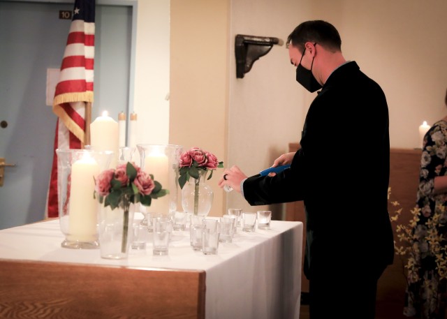 A guest lights a candle during the Pregnancy and Infant Loss Remembrance observance at LRMC, Oct. 15. The observance is held annually on Oct. 15 to remember pregnancy loss and infant death which includes but not limited to miscarriage, stillbirth...