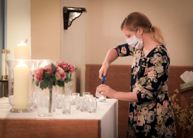 A guest lights a candle during the Pregnancy and Infant Loss Remembrance observance at LRMC, Oct. 15. The observance is held annually on Oct. 15 to remember pregnancy loss and infant death which includes but not limited to miscarriage, stillbirth or death of a newborn while also providing support to families who have suffered a loss.
