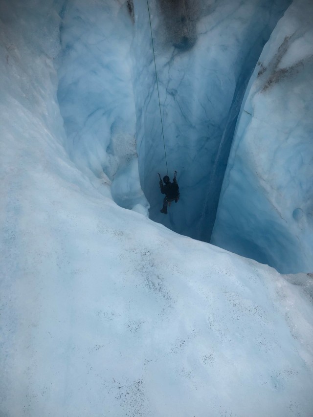A Green Beret with 1st Special Forces Group (Airborne) practices self-recovery from a glacial crevasse during Valor United 20, an arctic warfare training exercise in Seward, Alaska. During the September 2020 exercise, Special Forces and conventional soldiers alike developed their patrolling and survival skills in some of the most unforgiving terrain in the U.S. Key focus areas for the training were arctic, alpine and glacier movement, crevasse rescue, and long-range high-frequency communications. In addition to training, the 1st SFG (A) team assisted 212th Rescue Squadron with wilderness search and rescue operations.