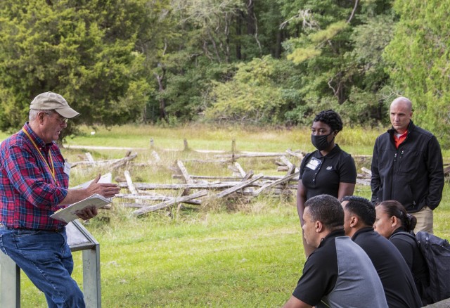 Stephen McGeorge, U.S. Army Training and Doctrine Command deputy chief historian (left) discusses the events that took place 239 years prior as British Gen. Charles Cornwallis surrendered Yorktown, Va., during a staff ride at the Yorktown, Va.,...