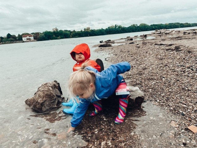 Wearing their wet-weather gear, the Landis children wade in a river. Photo provided by Jordyn Landis.