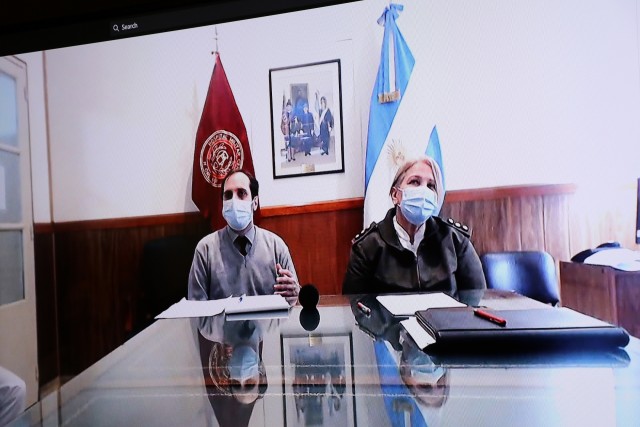 Argentine Army Col. Med Susana Pastor Arguello, Medical Director, Central Military Medical Hospital, Buenos Aires, Argentina, right, and translator Diego Blasco answer COVID-19 questions during a video teleconference with Brooke Army Medical Center doctors, Oct. 21, 2020. The video teleconference consisted of a panel of medical professionals discussing lessons learned to provide a compilation of best practices in response to the COVID-19 pandemic and other health-related topics. (U.S. Army photo by Robert A. Whetstone)