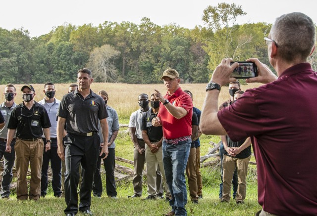 Gen. Paul E. Funk II, commanding general U.S. Army Training and Doctrine Command (Center/right), along with Command Sgt. Maj. Daniel T. Hendrex, TRADOC senior enlisted adviser (center/left), record a public service advisory message for social media purposes during a staff ride at the Yorktown, Va., Battlefields Oct. 19, 2020. The staff ride was a reward for the nation’s top performing Army recruiters and drill instructors with a primary focus on resiliency and mentorship. (U.S. Army photo by David Overson)