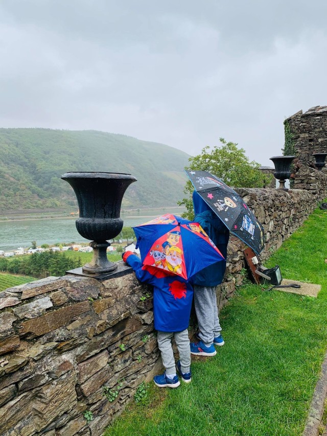 WIESBADEN, Germany-The Sweeney brothers watch over the river with their umbrellas. Photo provided by Karla Sweeney.