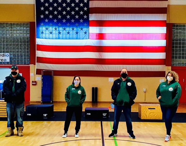 From L to R, Baumholder CYS Sports Program Equipment and Facilities Assistant Randy Ault, Fitness Specialist Andhia Campos, Director Marcel Fisher, and Assistant Director Whitney Clemmons. (Photo courtesy of Baumholder CYS.)