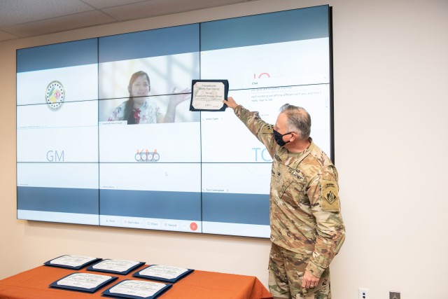 USACE Middle East District Commander COL Philip Secrist presents a certificate to architect Angelivette Nieves-Viruet who completed the recent Leadership Development Program Tier I and graduated virtually from Puerto Rico. Other members were in...