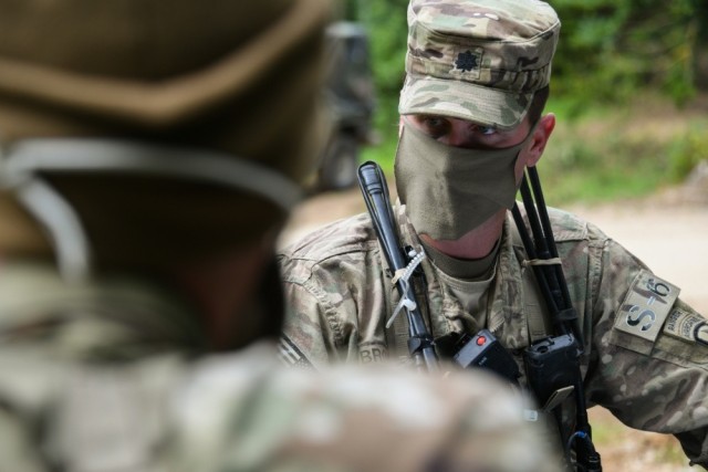 Lt. Col. Joshua Brown, commander of 1st Squadron, 91st Cavalry Regiment, 173rd Airborne Brigade, talks with his Soldiers during a reconnaissance exercise at 7th Army Training Command&#39;s Hohenfels Training Area, Germany, June 5, 2020. Despite...