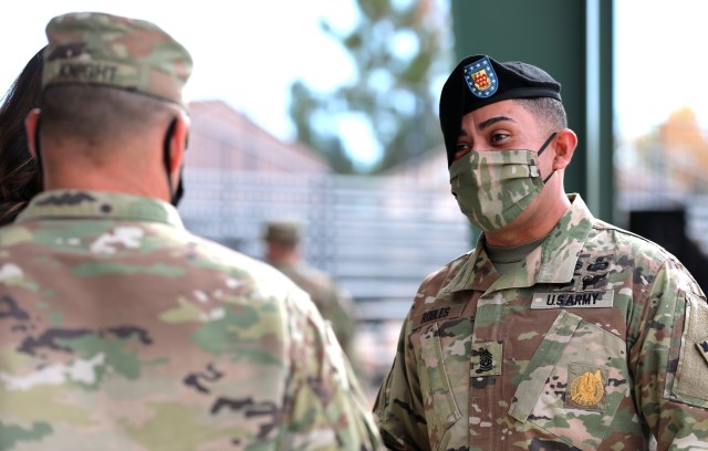 Command Sgt. Maj. Jesus Robles (right), command sergeant major of 2nd Battalion, 77th Field Artillery Regiment, 2nd Stryker Brigade Combat Team, 4th Infantry Division, greets Col. Scott Knight, commander of 2SBCT, 4th Inf. Div., following a change of responsibility ceremony Oct. 16, 2020 at Fort Carson, Colo. 