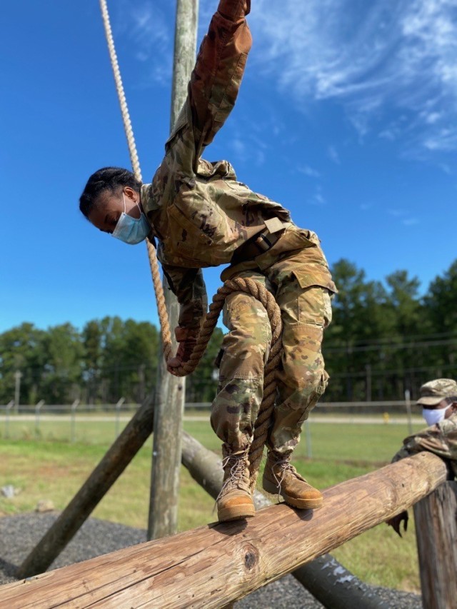 Cadet Shankle maneuvers the Swing Stop Jump obstacle