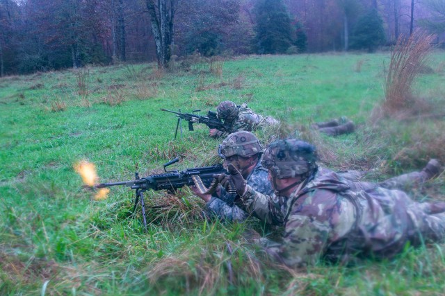 U.S. Army Soldiers from 1st Brigade Combat Team, 101st Airborne Division, firing M240B machine guns from their firing positions at the final assault during the 26-hour tactical training portion of Bastogne Forge Oct. 28 in Dahlonega, Ga. The...