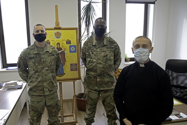 Task Force Illini’s Unit Ministry Team, Staff Sgt. Gregory Baumgartner and Chaplain (Maj.) Vincent Lambert meet with the Armed Forces of Ukraine’s Deputy Head of Military Chaplaincy, Father Andriy Zelinskyy in Kyiv, Ukraine, Oct. 21. (Photo by Sgt. Gregory Glosser Task Force Illini Public Affairs.)