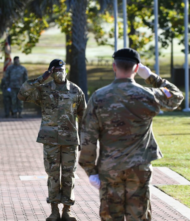 Command Sgt. Maj. Algrish C. Williams Sr., salutes Fort Jackson Garrison Commander Col. John "Wes" Hankins for the first time as  Garrison Sergeant Major, during his assumption of responsibility ceremony Oct .23 at Victory Field.