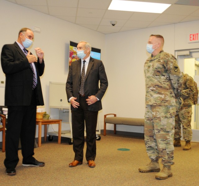 Honorable Dr. E. Casey Wardynski (center), assistant secretary of the Army for Manpower and Reserve Affairs, discusses education quality of life improvements with James Williams (left), Vernon Parish superintendent, and Col. Ryan K. Roseberry...