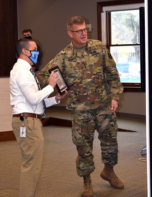 Michael Burrow, Bradley Elementary School principal, displays the school’s certificate of appreciation — awarded by Combined Arms Center and Fort Leavenworth commanding general Lt. Gen. James Rainey to Bradley in recognition of the school...