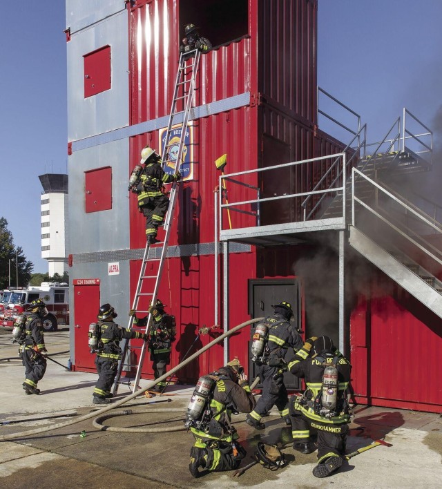 Fort Belvoir firefighters work to extinguish a fire in the new training facility at Davison Army Airfield, Oct. 15.