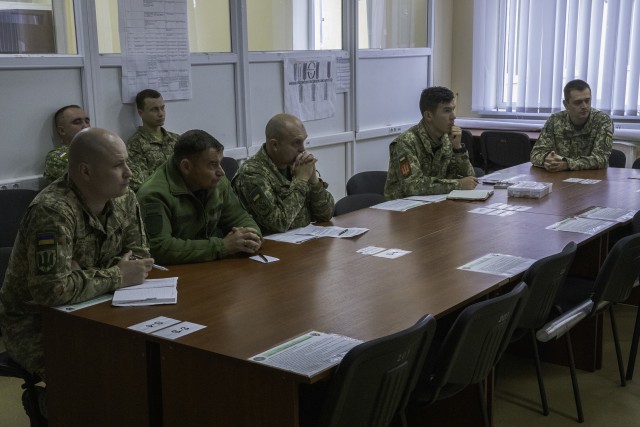 Ukrainian Army Advisors attend a Wargaming seminar given by Task Force Illini representatives Oct. 6. (Photo by Sgt. Gregory Glosser, Task Force Illini Public Affairs.)