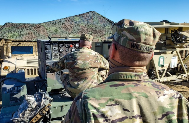 Chief Warrant 3 Mark Blom, the ground maintenance warrant officer assigned to the 204th Maneuver Enhancement Brigade, Utah National Guard, troubleshoots a field generator at a mobile tactical operations center during a Warfighter Exercise at Fort...