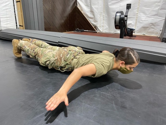 Supply Specialist Spc. Gianna Polizzi, Chicago resident, practices the hand release push-up event in the U.S. gym at Collective Training Center-Yavoriv, Ukraine Oct. 2. (Photo by U.S. Army Cpl. Alyssa Artola)