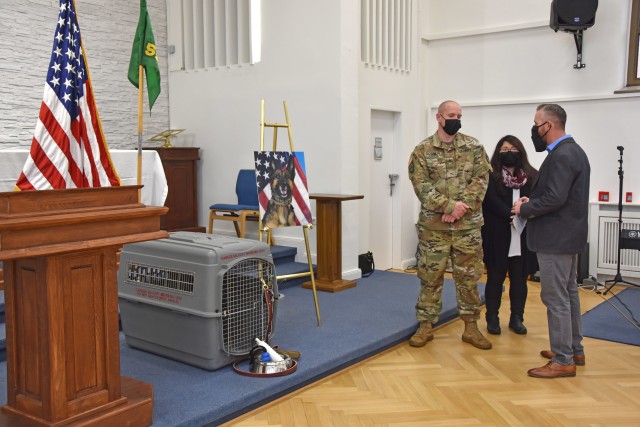 WIESABDEN, Germany - Supporters offer condolences to Sgt. Mathew Dobson, handler for military working dog Diana, of the 525th Military Working Dog Detachment, Oct. 30 during a memorial for her at the Clay Chapel. The 4-year-old patrol explosive dog (enhanced), passed away unexpectedly Oct. 16.