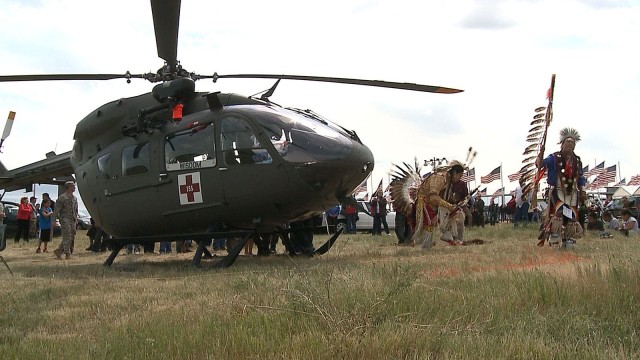 Two members of the Standing Rock Sioux Nation dance in traditional attire around a South Dakota Army National Guard UH 72 Lakota helicopter on June 10, 2012 after a blessing ceremony for the helicopter. The SDNG and the Lakota Nation have...
