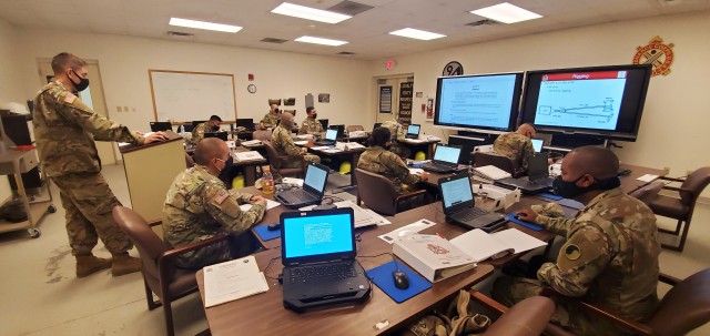 Sgt. Shane Griffin (left) with the Fort McCoy Regional Training Site (RTS)-Maintenance instructor staff, teaches a class Oct. 15, 2020, at Fort McCoy, Wis. The class is part of several courses started as part of the fiscal year 2021 curriculum at...