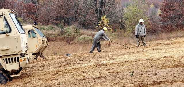 Soldiers at Fort McCoy, Wis., for training in the Regional Training Site-Maintenance Wheeled-Vehicle Recovery Operations Course work together during training Oct. 23, 2020, at the installation Vehicle Recovery Site on North Post. The 17-day course...